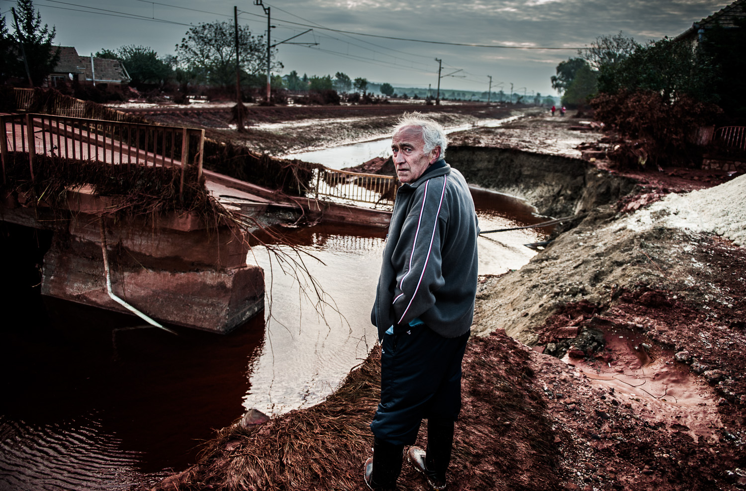 On the 4th October 2010., shortly after noon, the wall of one of the red sludge depositories of MAL Zrt. burst and the toxic sludge treated with alkaline substances toppled the thick concrete walls, flushing the nearby cities and villages. It destr