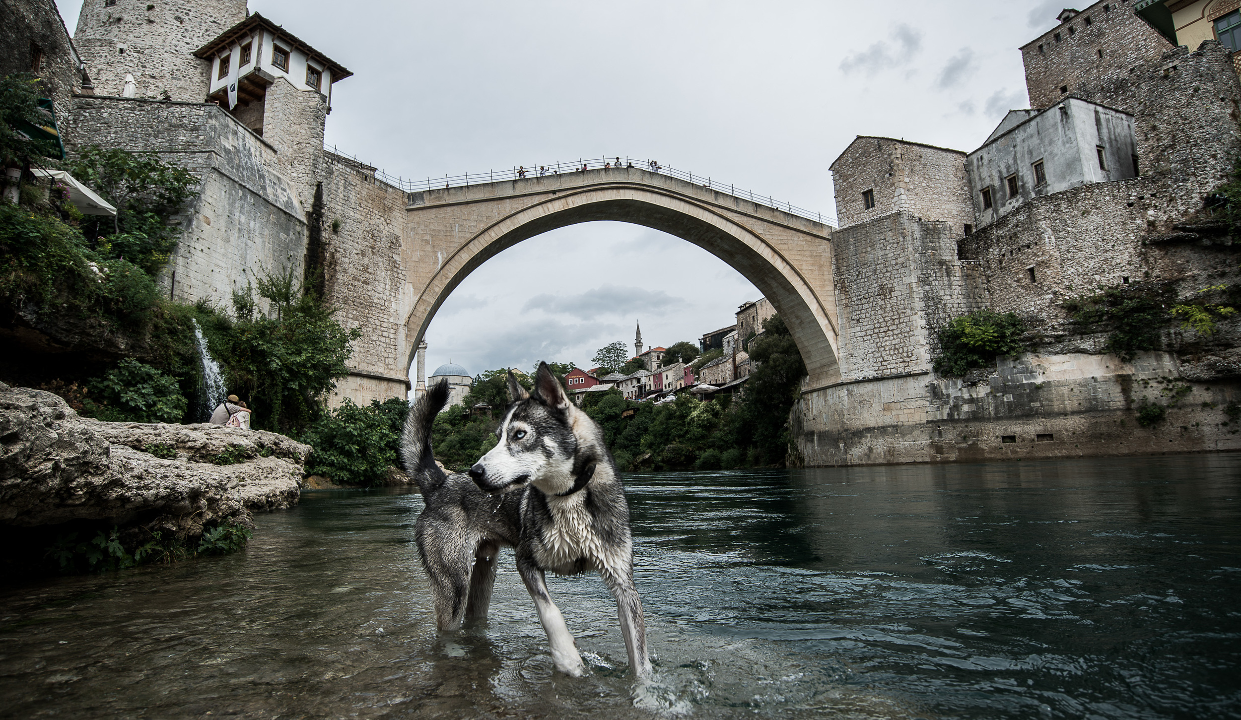 The rebuilt bridge of Mostar. After the wars in the Balkans the citizens of Bosnia and Kosovo are finding their own way. There are still allied troops guarding the peace in both countries and the young democracy in the region is
