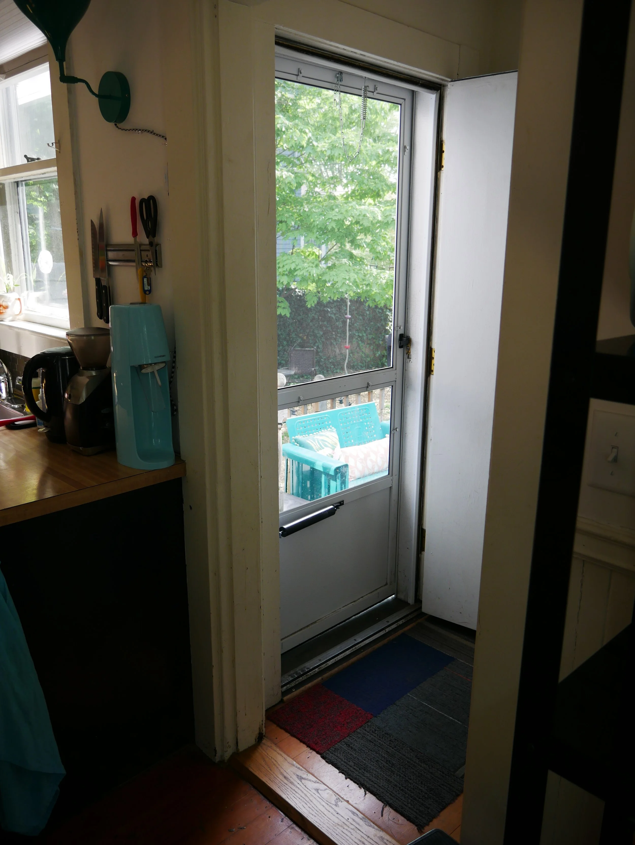 Before shots! This "mudroom" was elminated for a more streamlined access to the back porch and yard.