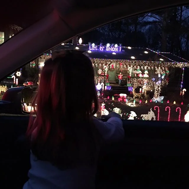 We drove through the Gaddy's Christmas light display. They have a bazillion lights/blow up things/ lawn ornaments etc. Hattie thought it was pretty cool that she got to get out of her car seat and sit in my lap. She pointed out every baby Jesus and M