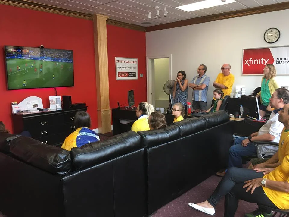 Attendees pensively watch a World Cup match