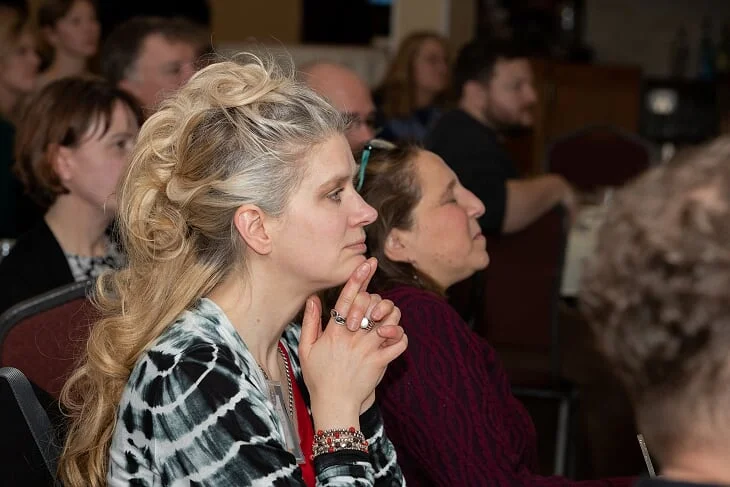 Tara Mantel, owner of n+1 cyclery, listens intently during the Celebration