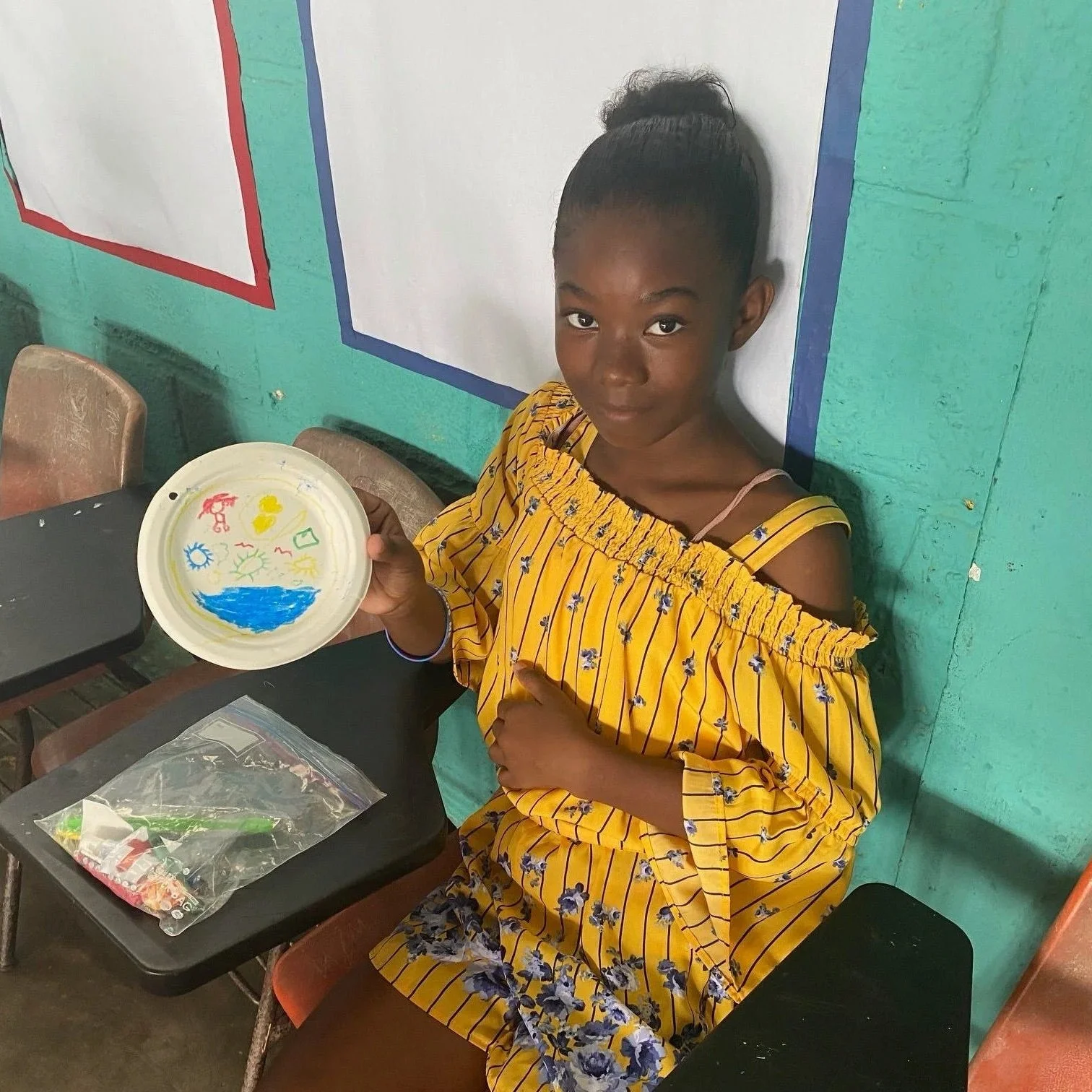 Young girl with her art.