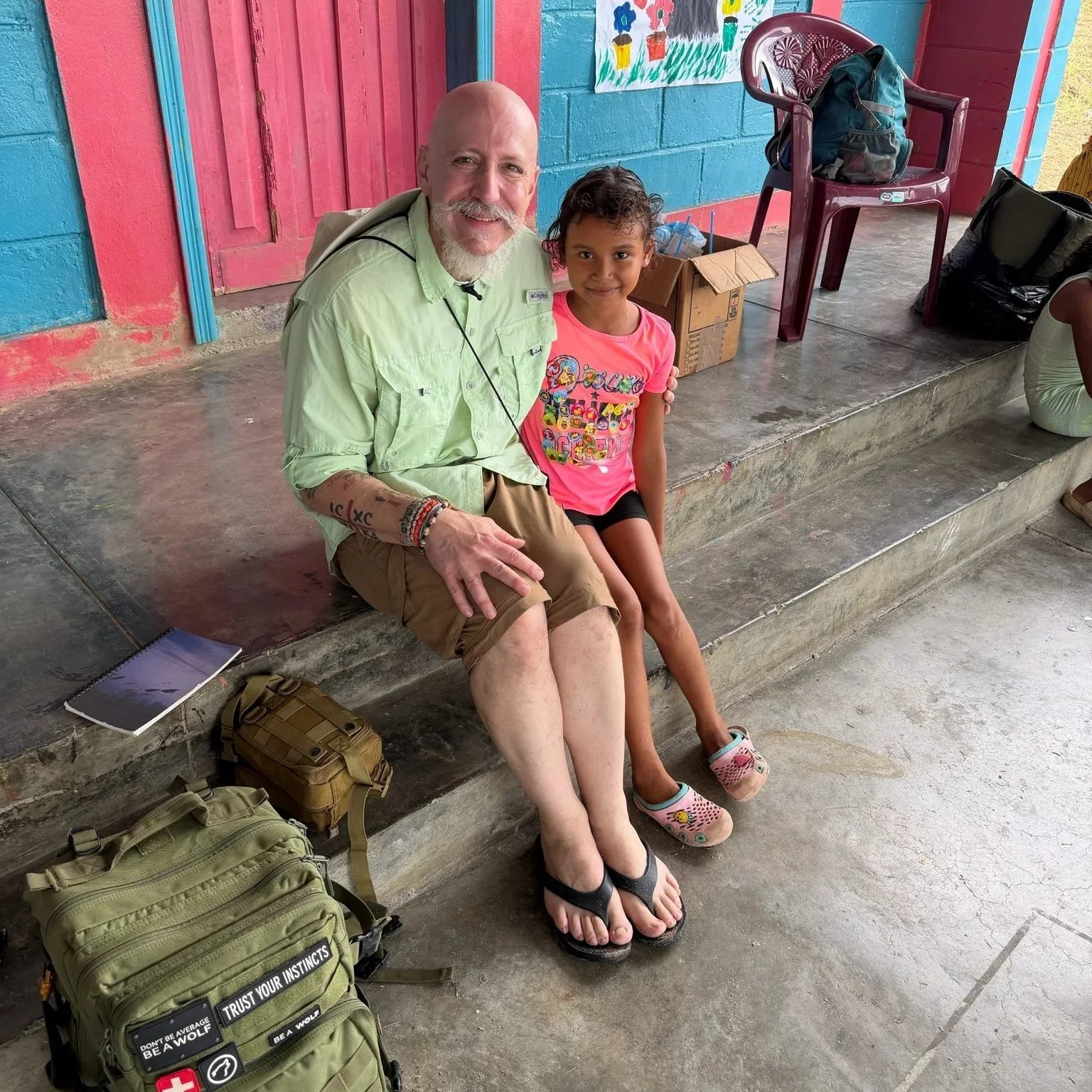 Dr Marco with a young girl.