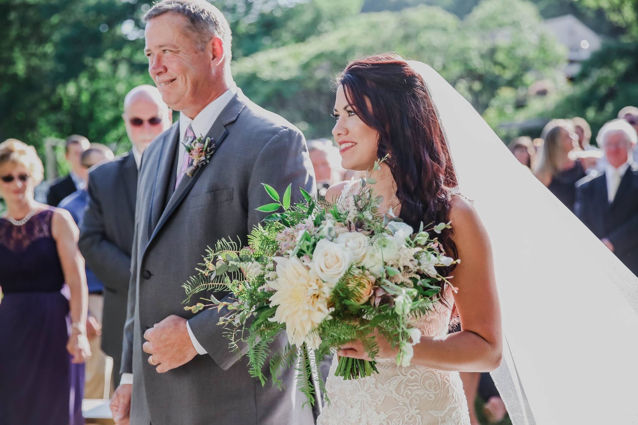 Kirsten's bouquet was a palette of pastel colored flowers: Cafe au Lait Dahlias, 'Caramel Antike' garden roses , locally grown Sweetpeas , Ranunculus and purple succulents.