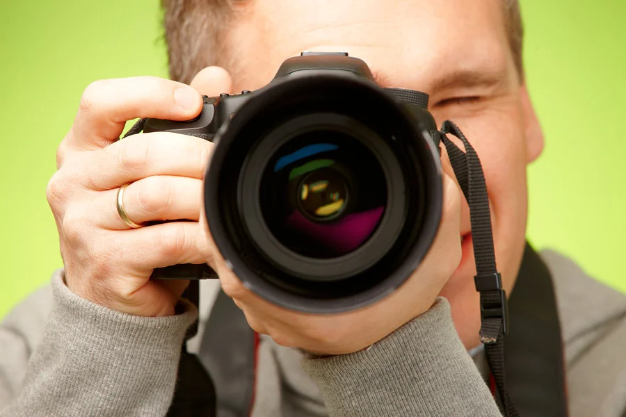 bigstock-Male-photographer-taking-photo-32517002.jpg