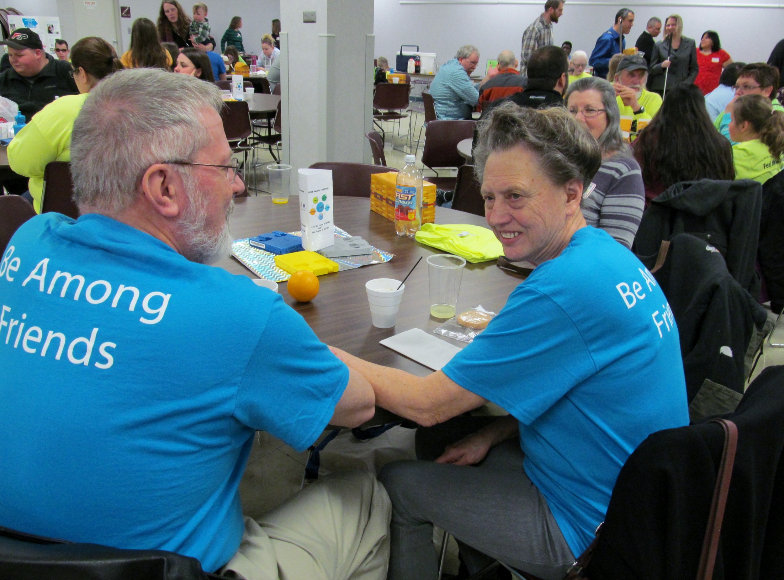 Arlo and Elsie model Among Friends t-shirts