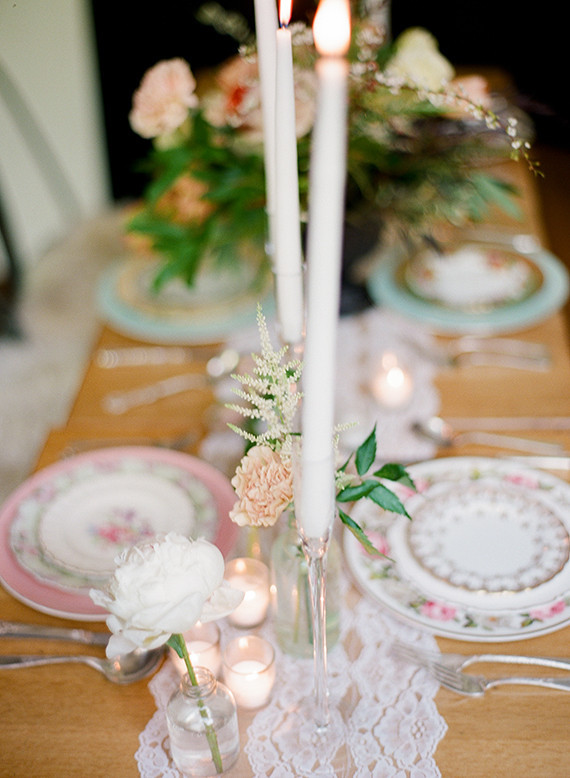 A little lace, a lot of bud vases, tea lights, vintage china an flatware... What is more to love?