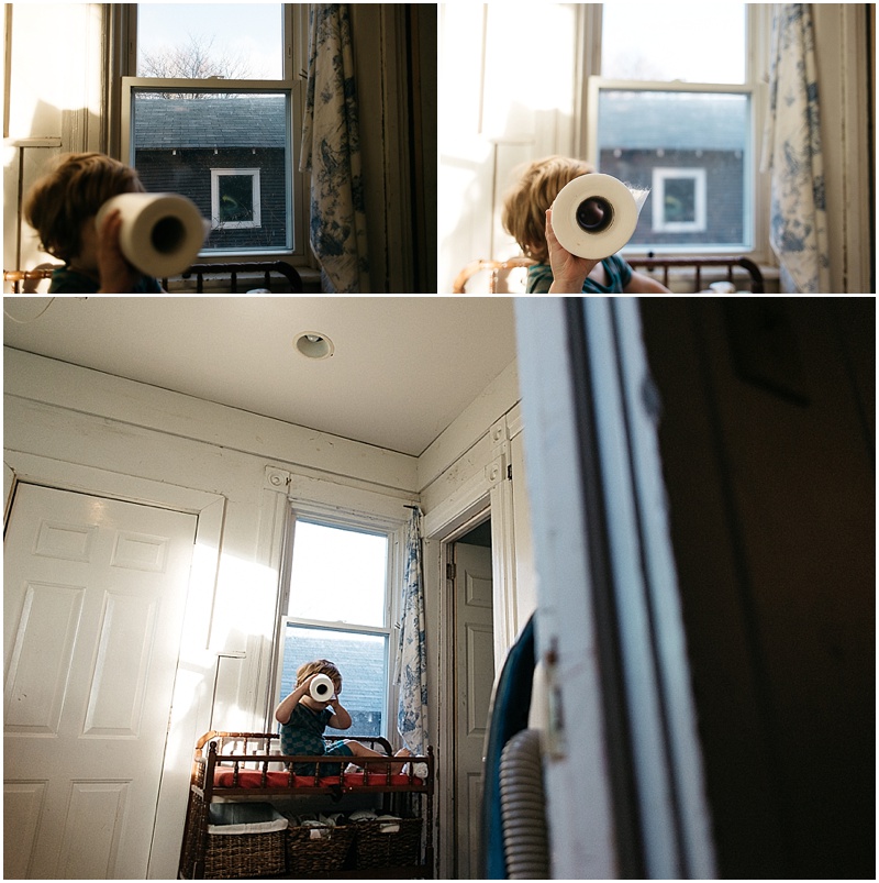 white getting his diaper changed, gus uses the roll of cloth diaper liners as a telescope, surveying the land.