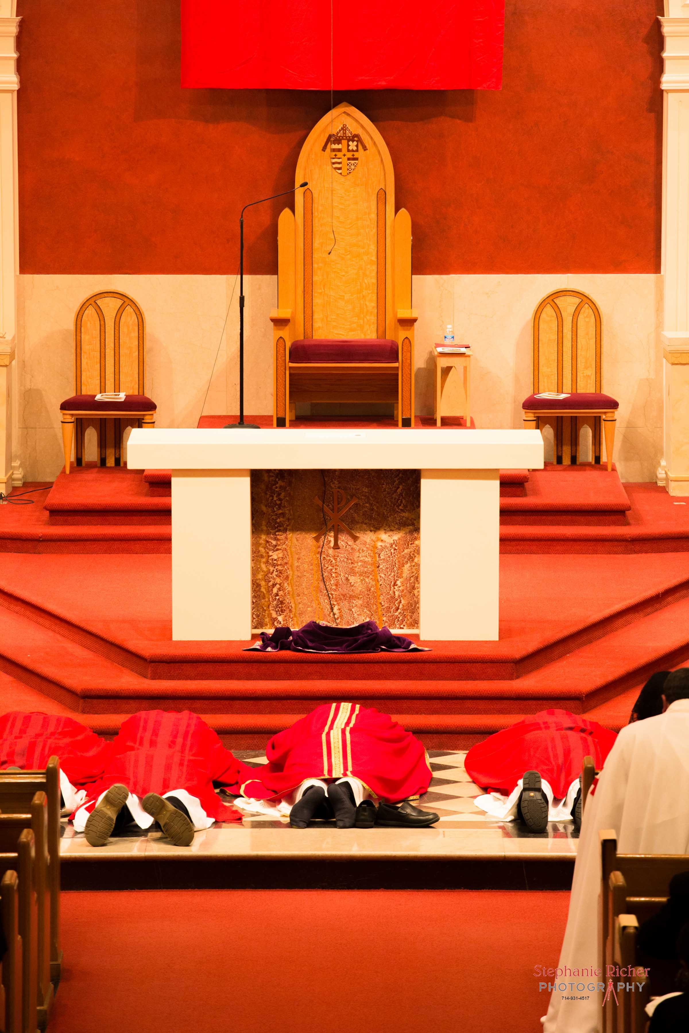 Bishop Stika and brother priests.