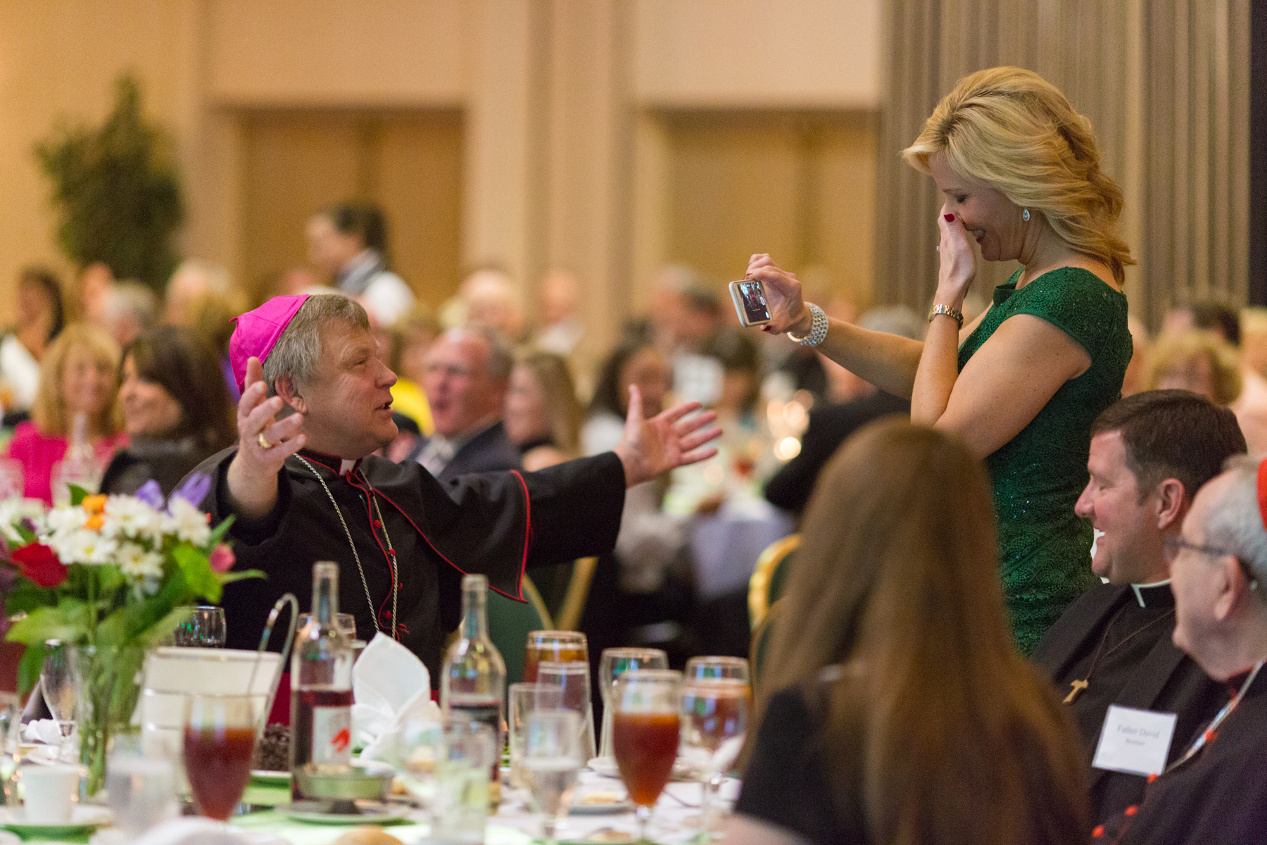 Bishop Richard Stika gets newscaster Kris Farley of WATE-6 TV to lose her composure.