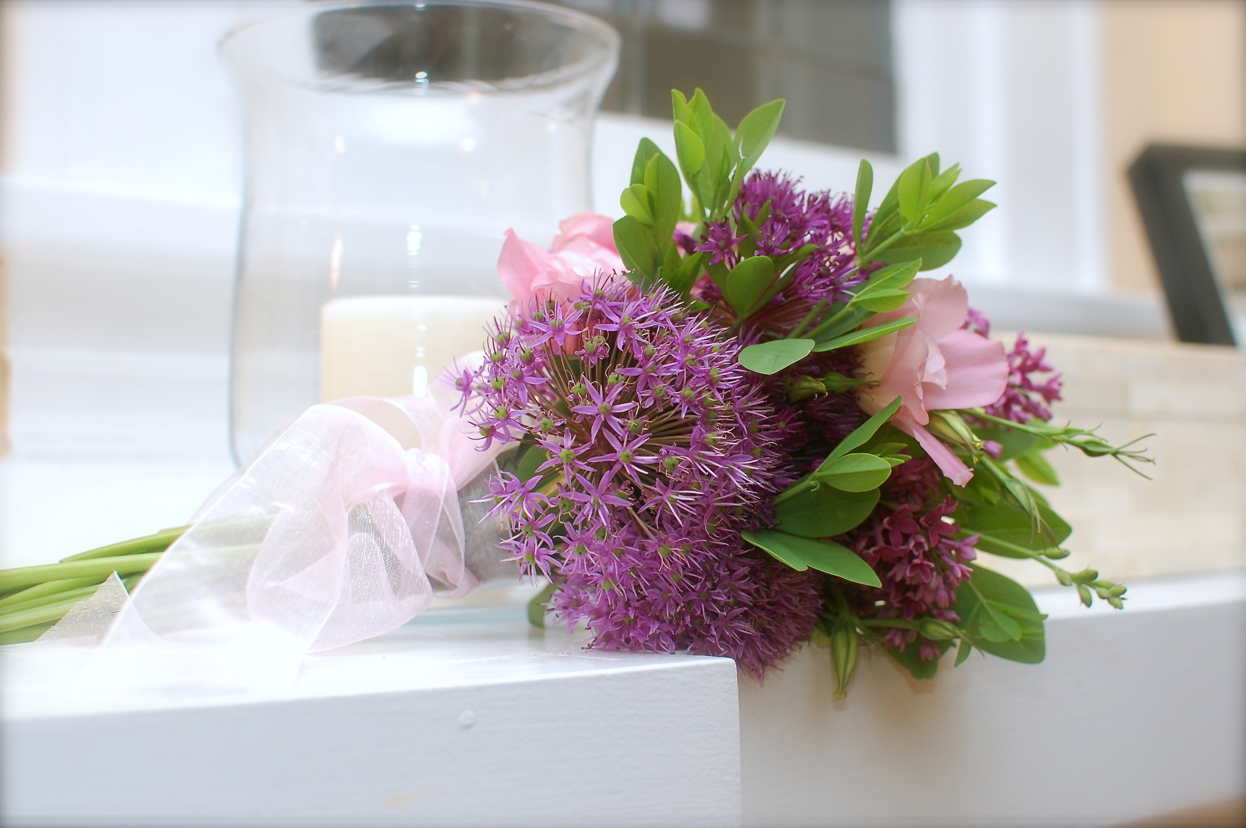 Delicate bouquet of allium, baptisia, lisianthus, and lilac.