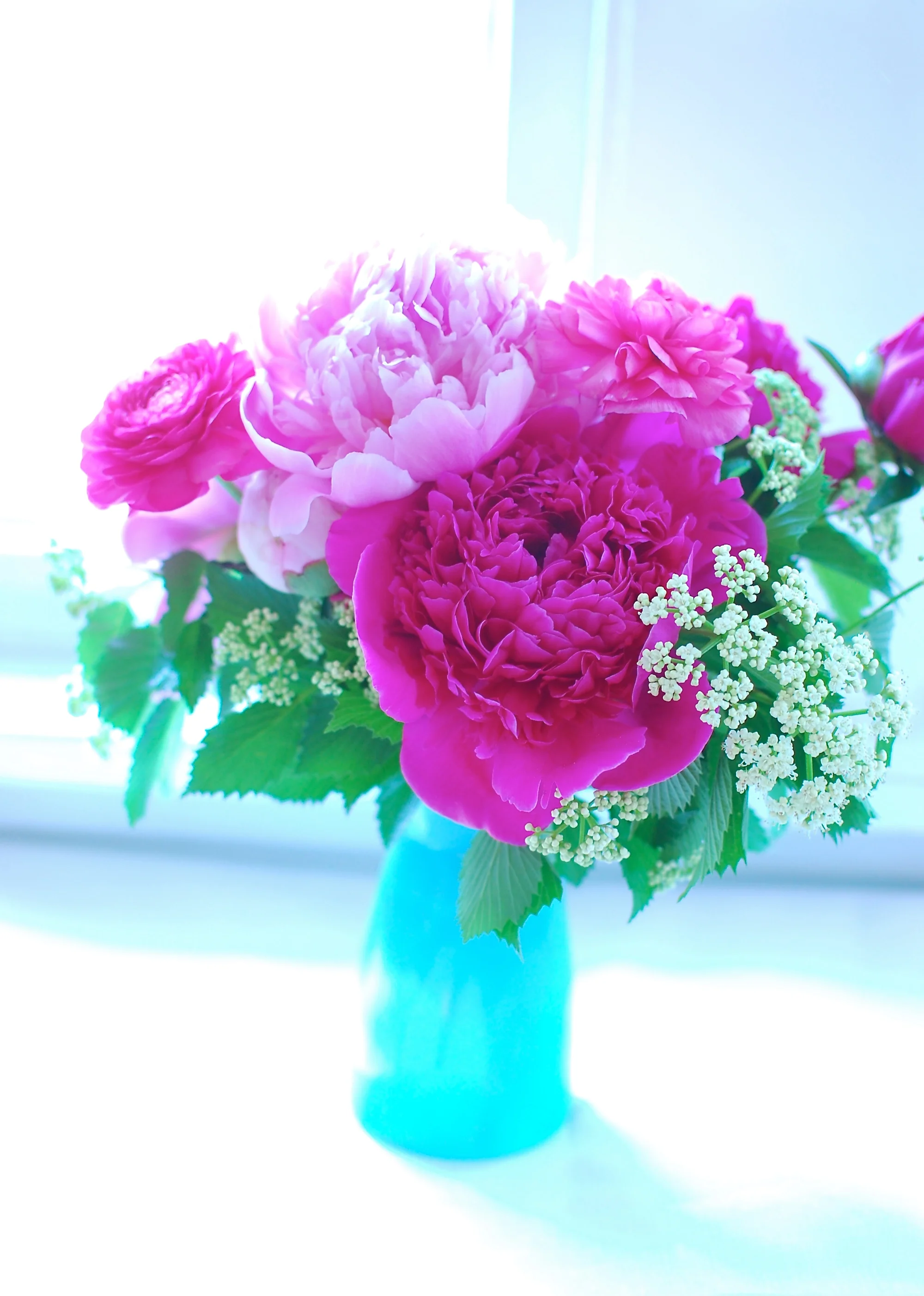 Peonies, ranunculus, and some greenery