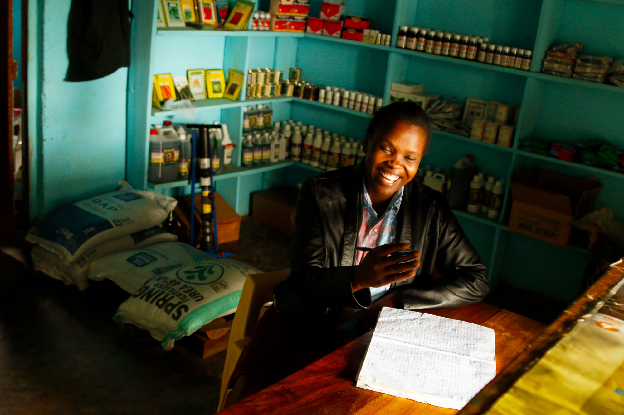 Maureen Simiyu runs a farm supply shop in Bungoma, Kenya. Because many small-scale farmers struggle to afford basic supplies, business is often slow. When drought hits, it can drop by half. (Tim McDonnell)