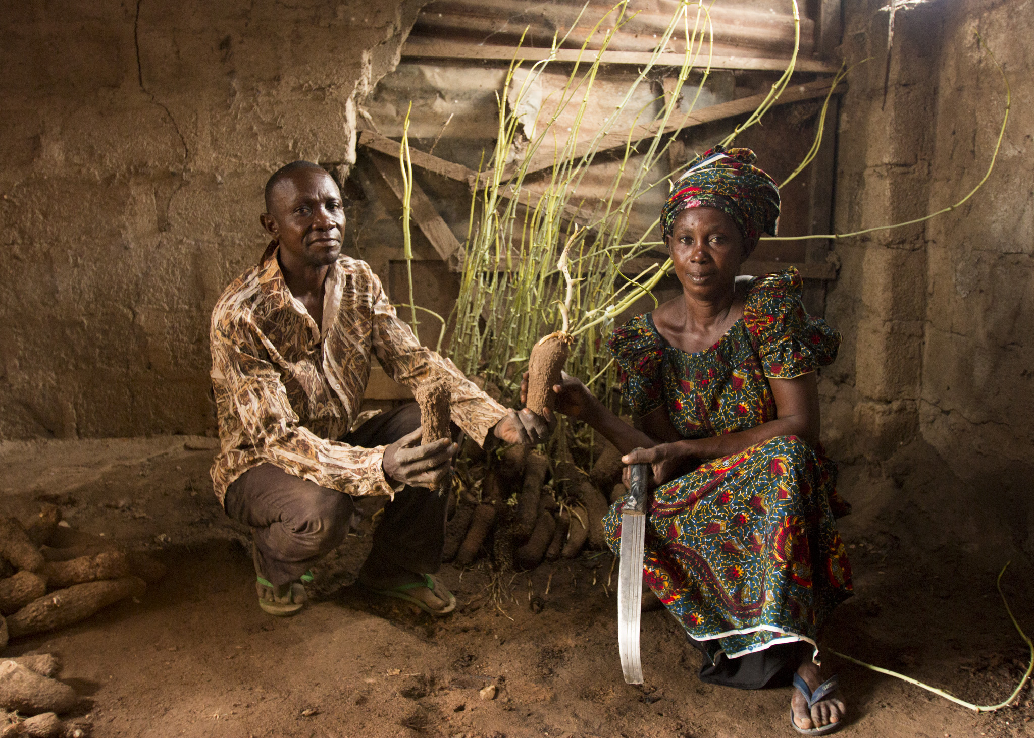 Ladi Adaikwu, right, and her business partner, Musa Ogbeba, run one of the few high-quality seed yam shops in central Nigeria. (Tim McDonnell)