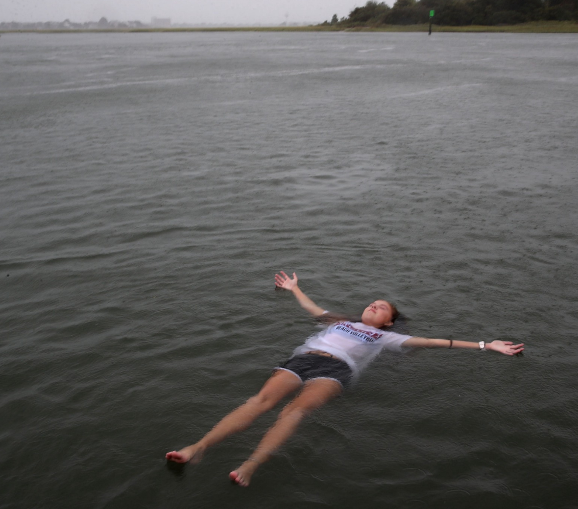 WILMINGTON, NC — September 13, 2018: Elizabeth Claire Toomer floats while swimming with friends in the Intracoastal Waterway as Hurricane Florence approached the area. Photo by Mark Wilson/Getty Images News/Getty