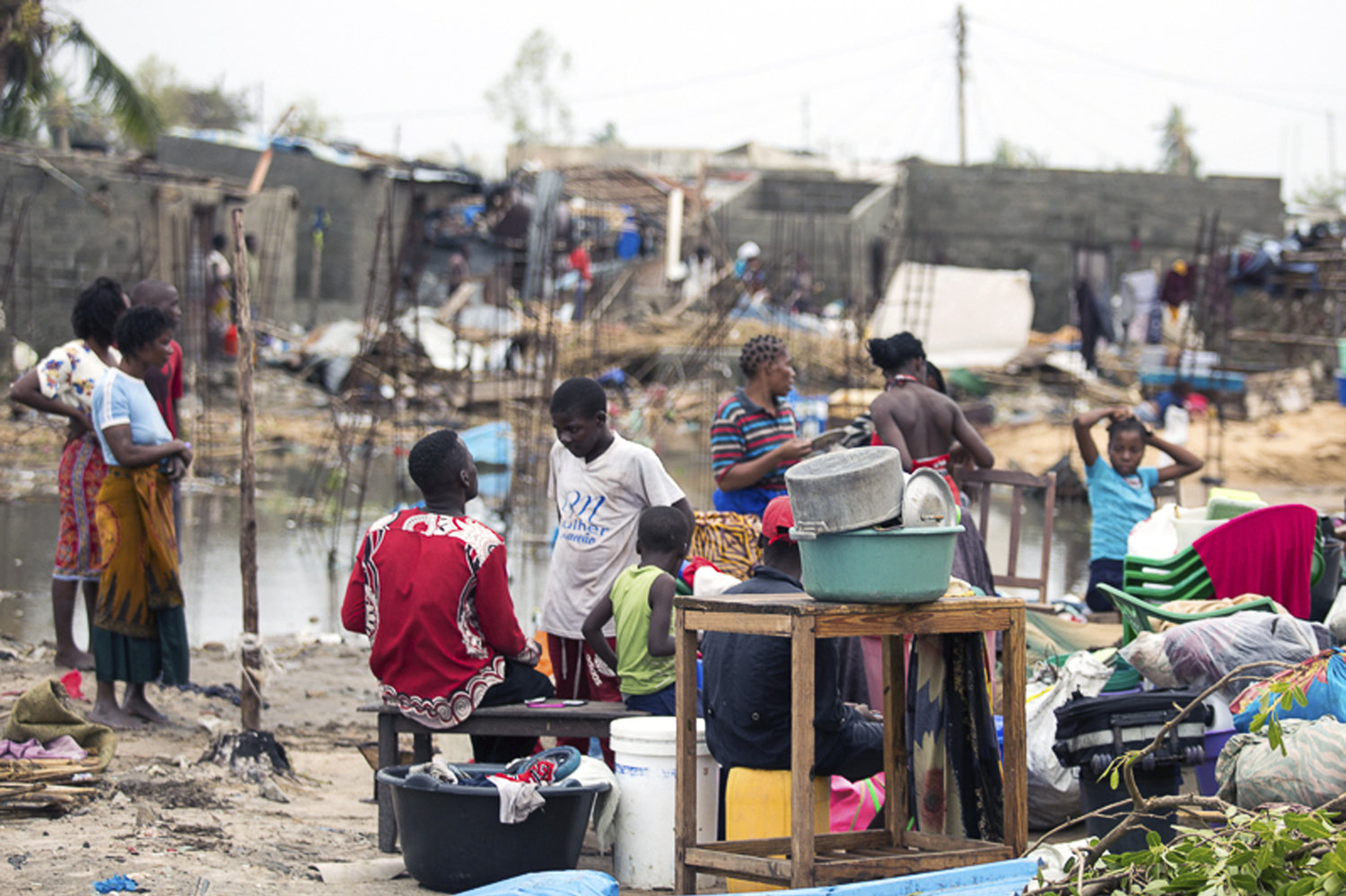 Residents of the city of Beira, which was nearly destroyed by Cyclone Idai, salvage what is left of their belongings. Denis Onyodi/International Red Cross via AP