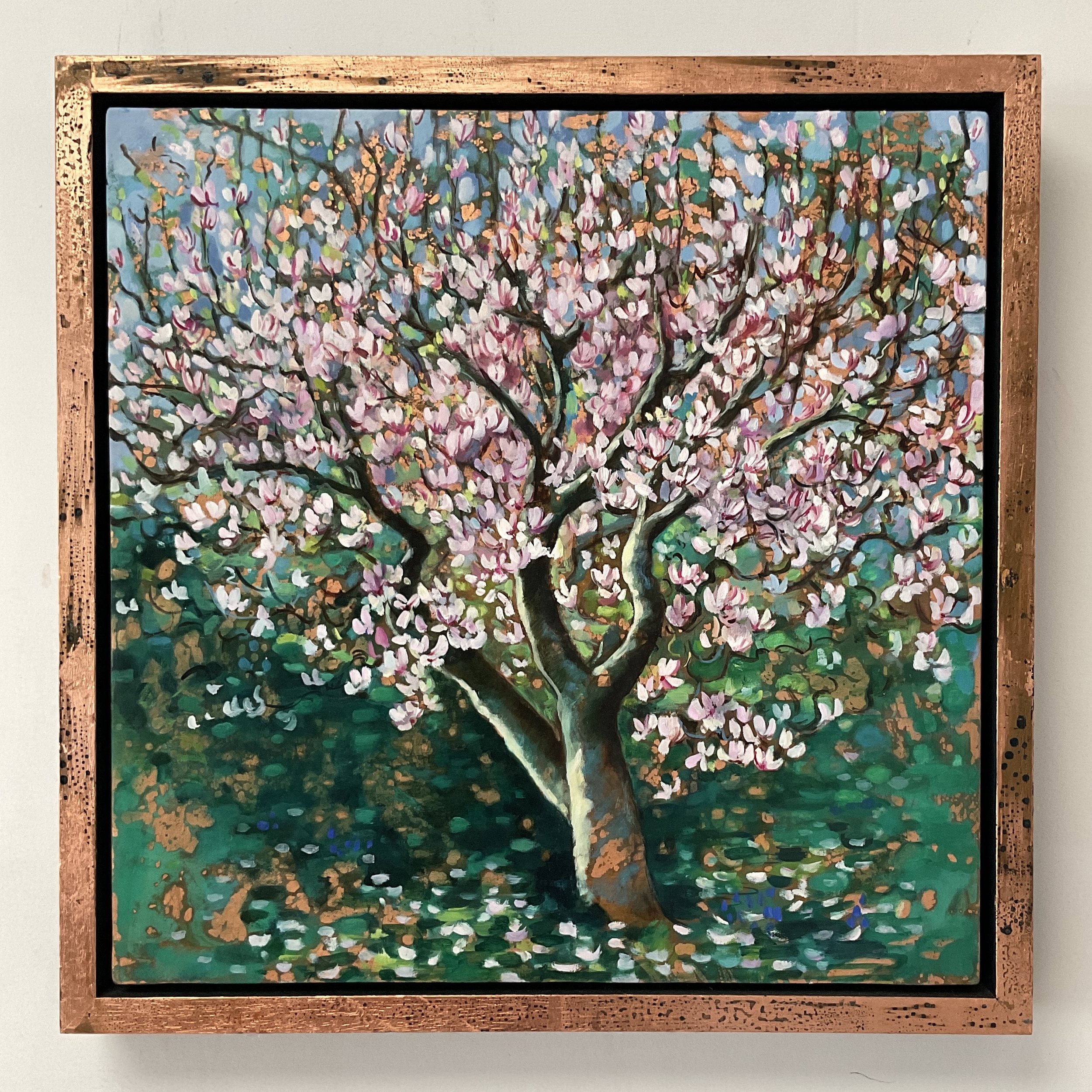 Painting by Alexandra Brown of Magnolia tree with pink flowers with dappled sunshine expressed by shining copper-leaf, framed