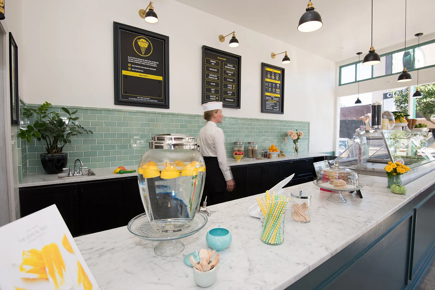 Lovely, hand made tiles by Waterworks and light fixtures by Schoolhouse Electric set the tone for the space.