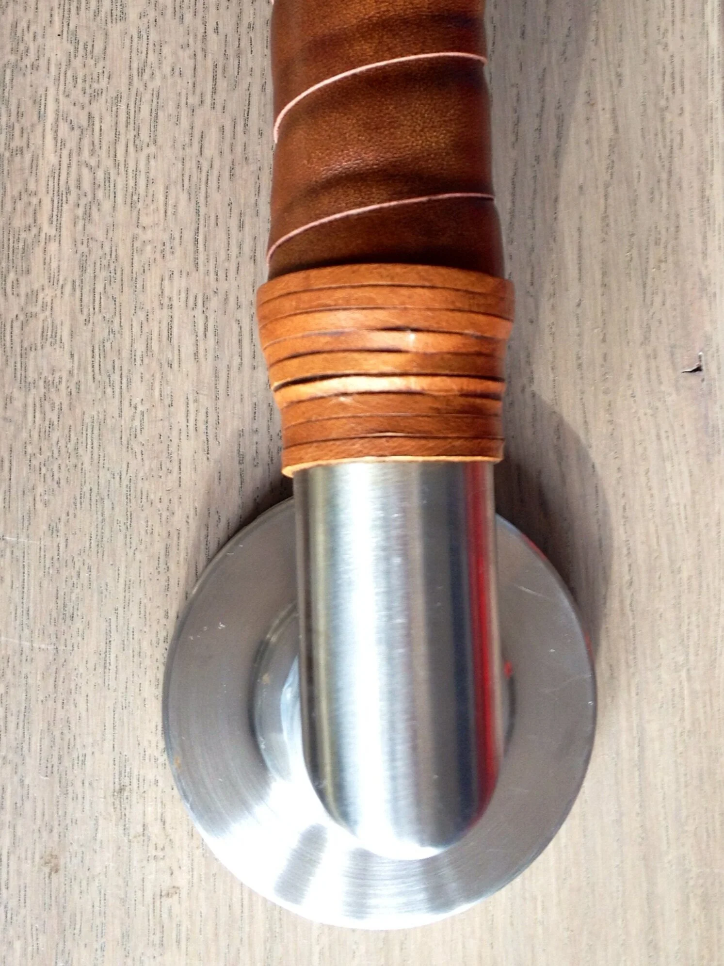 Leather wrapped grab bar for the rooftop deck entrance