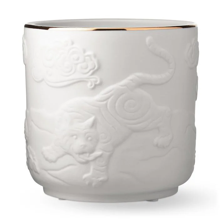 Williams Sonoma Home bas relief Tibetan Tiger planter. Matte bone china with gold lip.