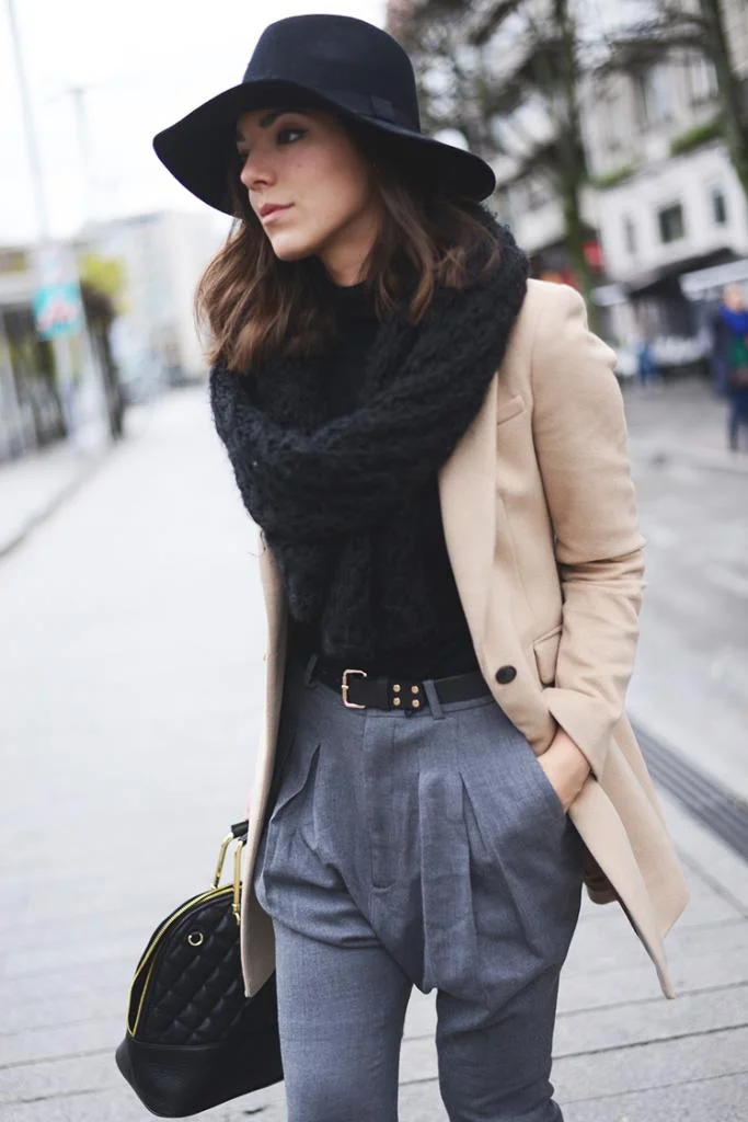 These grey “baggy pants” look incredibly comfortable all the while maintain the professional and respectful front pleat. By combing slouchy or baggy pants with a camel jacket and belt the look is made more chic and less EEK. (From: thefashionthroughmyeyes.com ) 