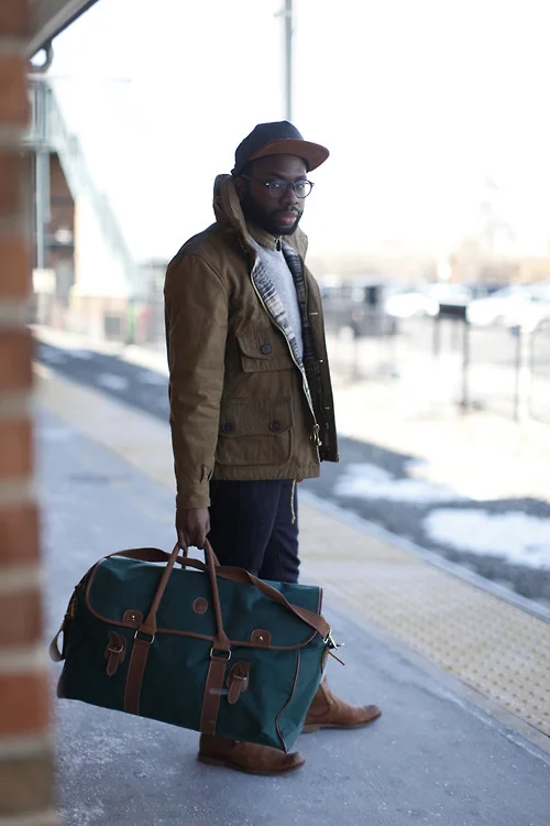 A large duffel is a great, more office friendly alternative to a backpack. Itβs also a nice switch up from a briefcase. If I had a job, Iβd own one. But overall, the look is on point. Honorable mention to the snapback-just beautiful | From: blackfashion.tumblr.com