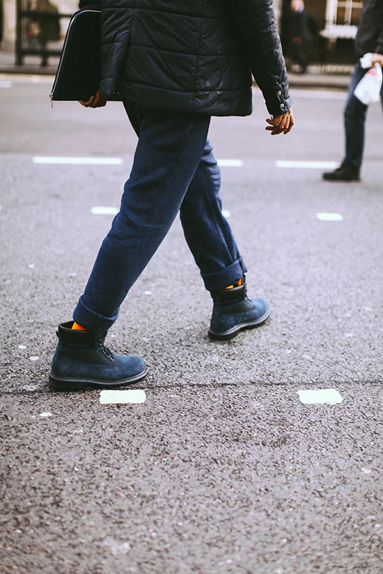 Navy wool pants, matching navy boots, and orange socks? Yum! | From: blogs.nordstrom.com