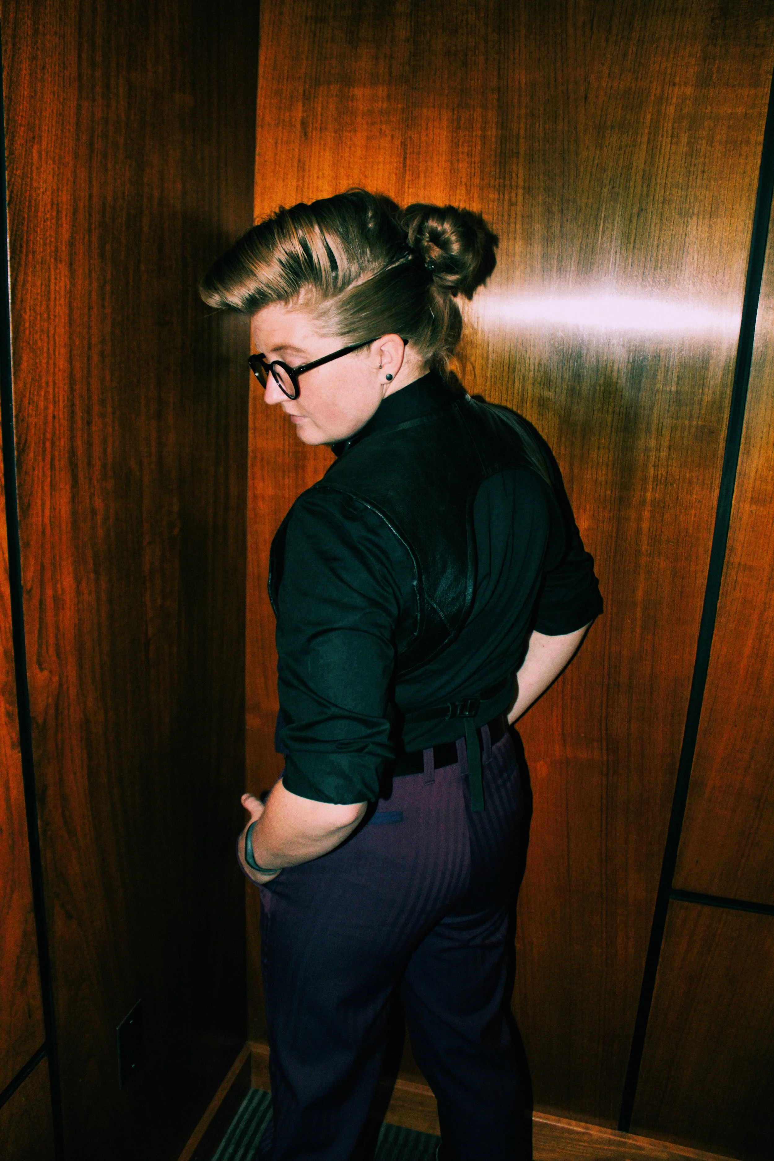 This vest is the birth child of a leather daddy's harness and a gentleman's waist coat. The leather trim matched with the deep purple was simply to die for.