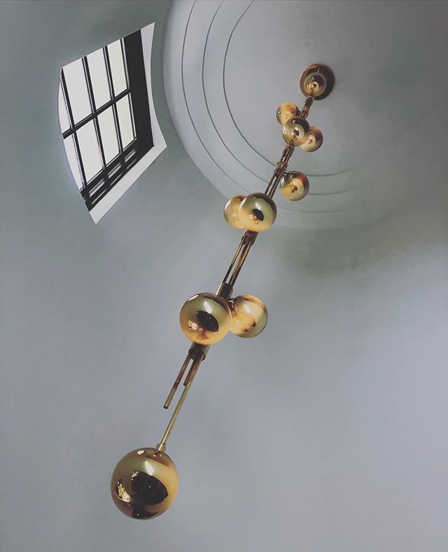 Custom designed gold glowing chandelier for the deco foyer. #muranoglass #chandelier #interiordesign #artdeco #miamibeach #design
