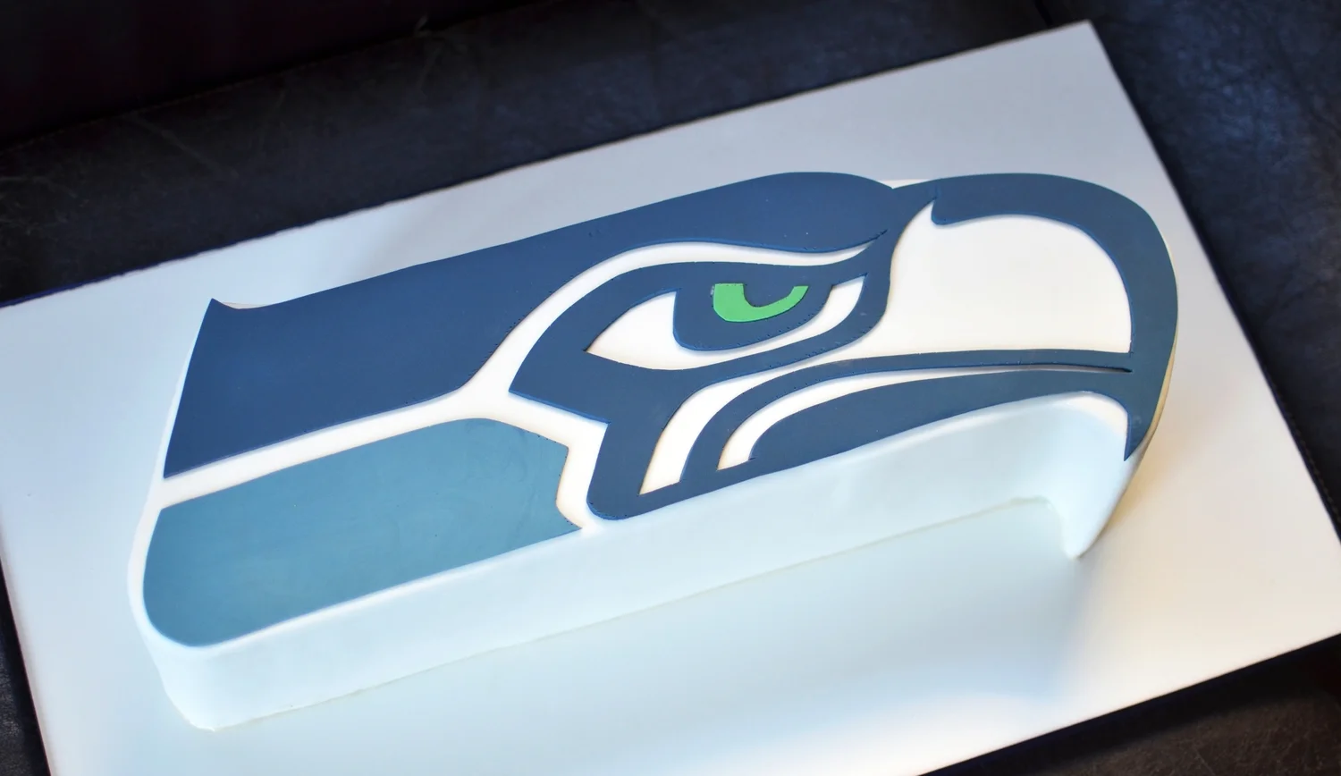 Seahawks cake with handcut logo. Image © Carla Schier