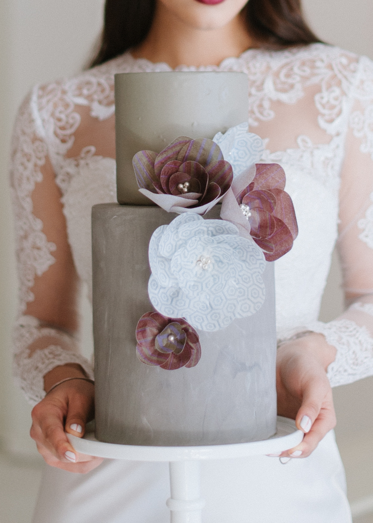 Concrete-textured wedding cake with wafer paper flowers. Image © Blue Rose Photography.