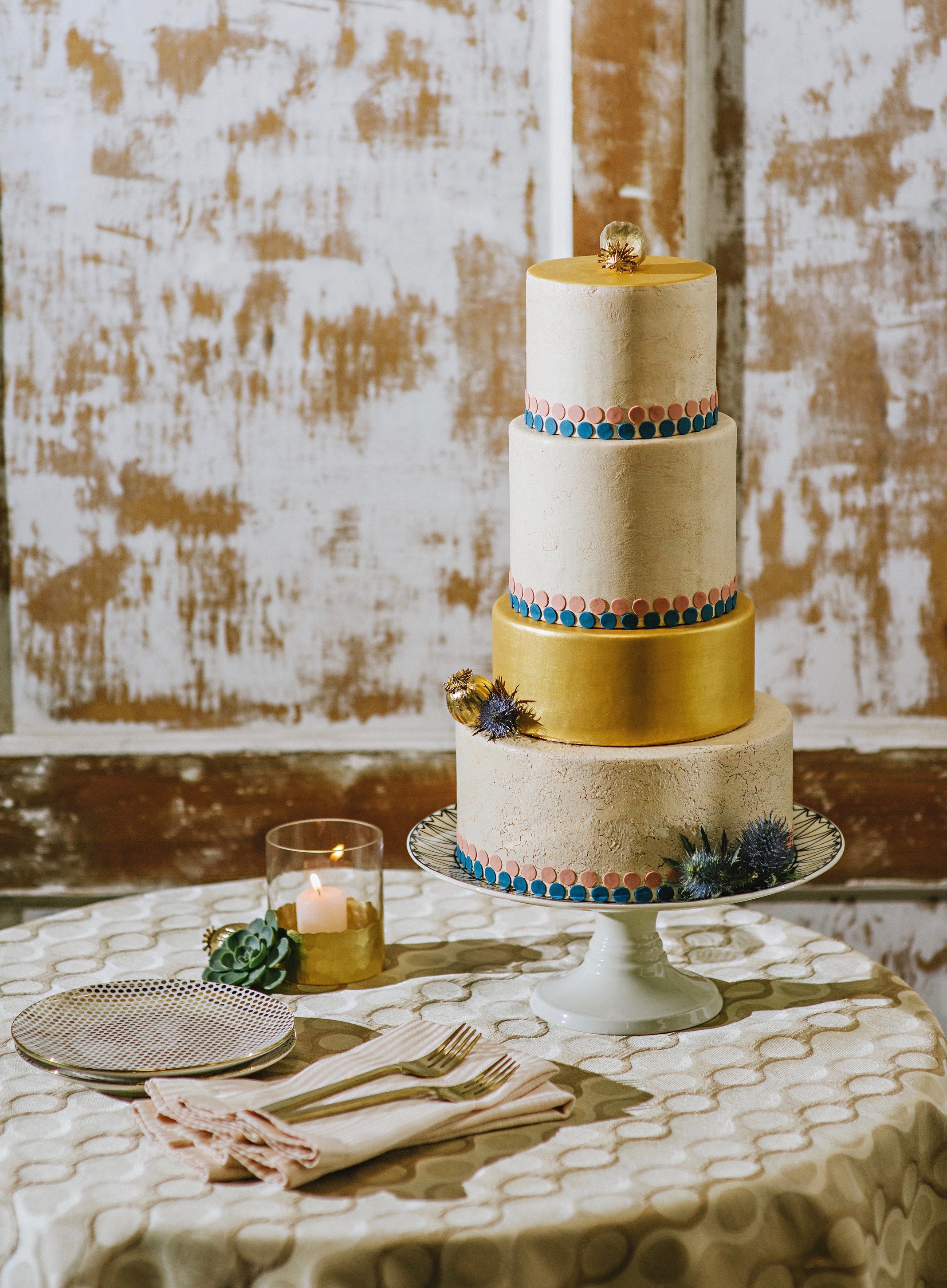 Crackle textured cake with gold, navy and dusky pink details. Image © Suzanne Rothmeyer Photography.