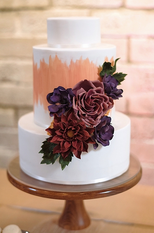 Handpainted cake with sugar flower cascade. Image © Shane Macomber Photography