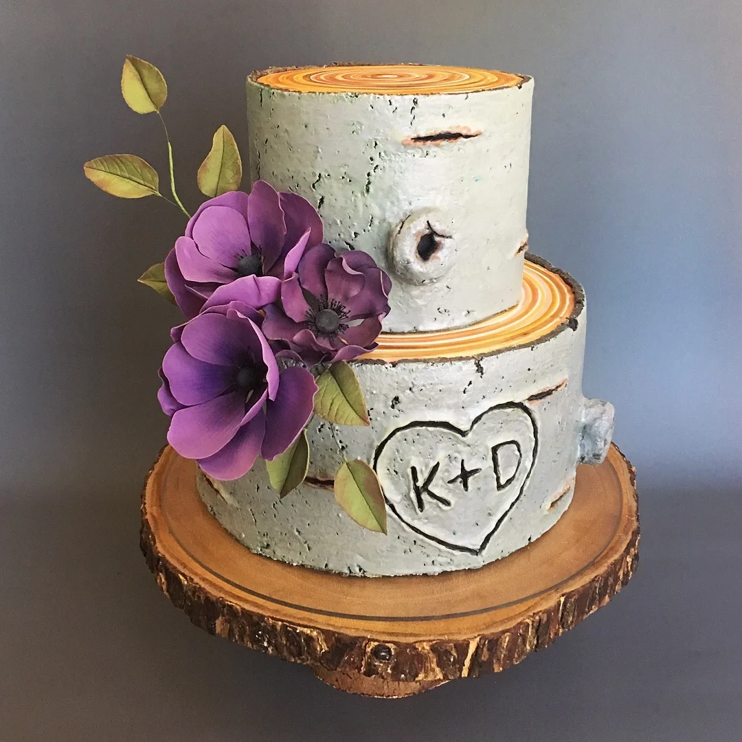 Custom cherry tree bark cake with sugar anemone flowers. Image copyright Carla Schier.