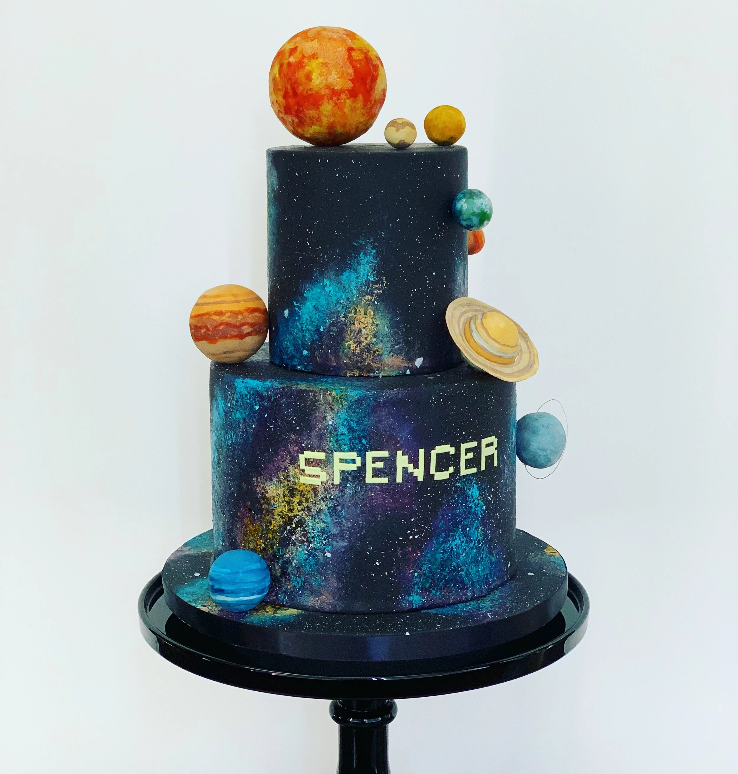 Solar system cake with hand painted veil nebulae. Image copyright Carla Schier.