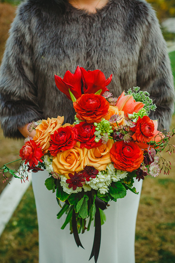 Aggie's asymmetrical bridal bouquet with blush roses and jeweled blooms on a bed of jasmine and gardenia.