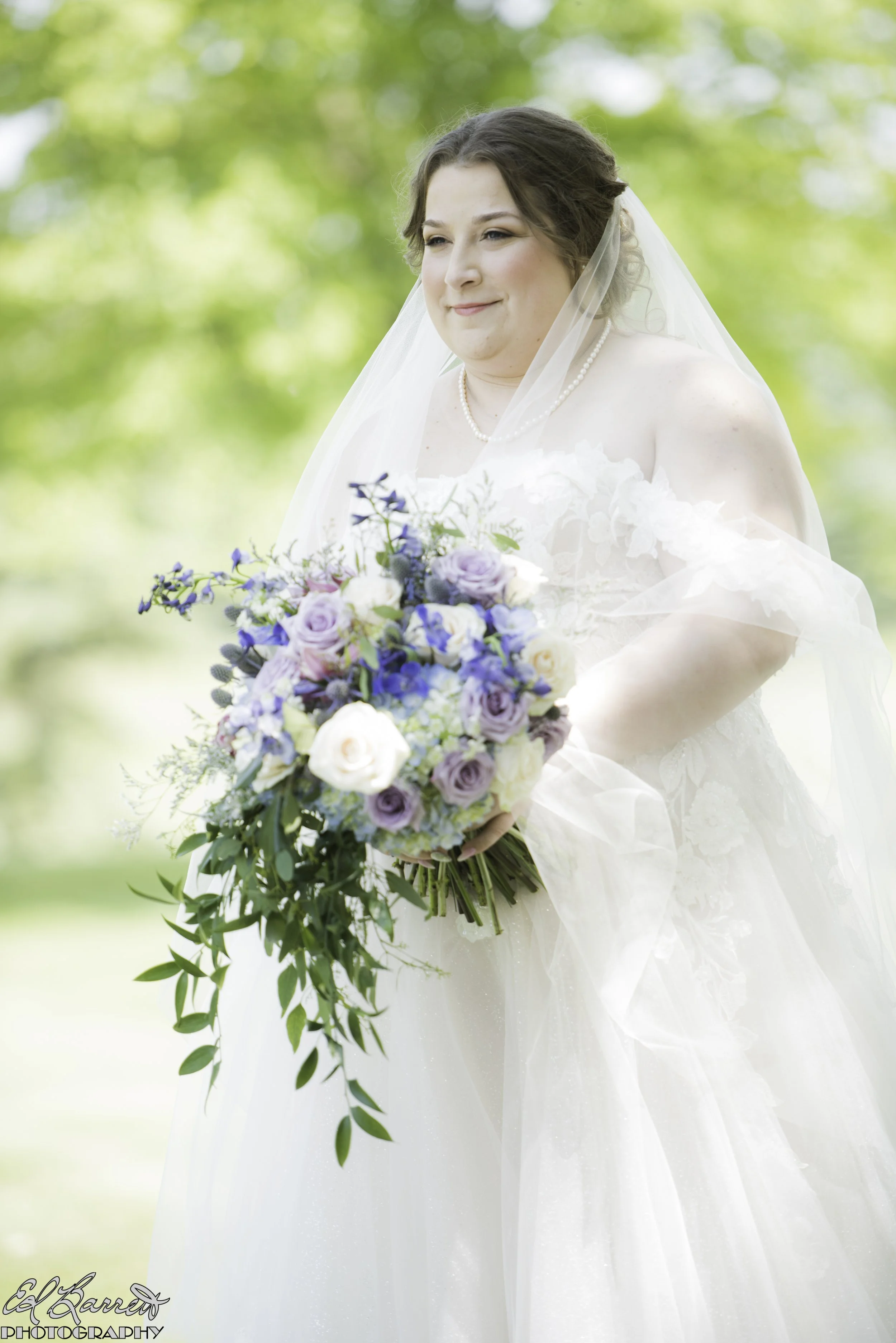 Bride_alone_flowers_front_standing.JPG