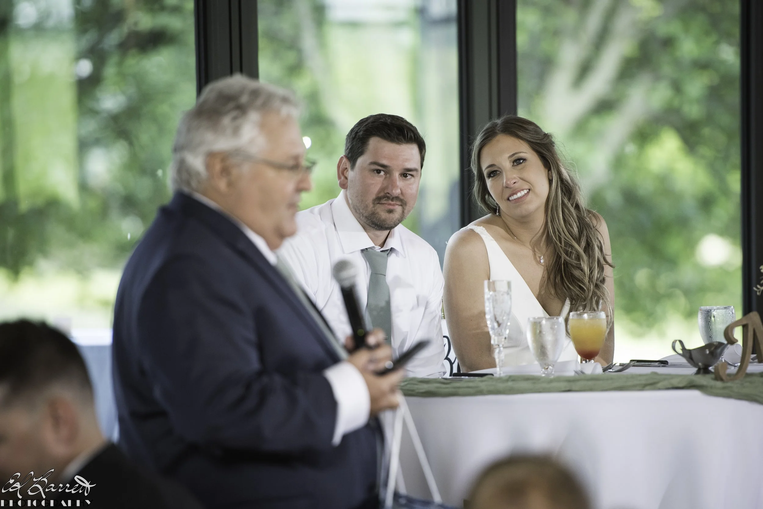 Bride_groom_reception_table_speeches.JPG