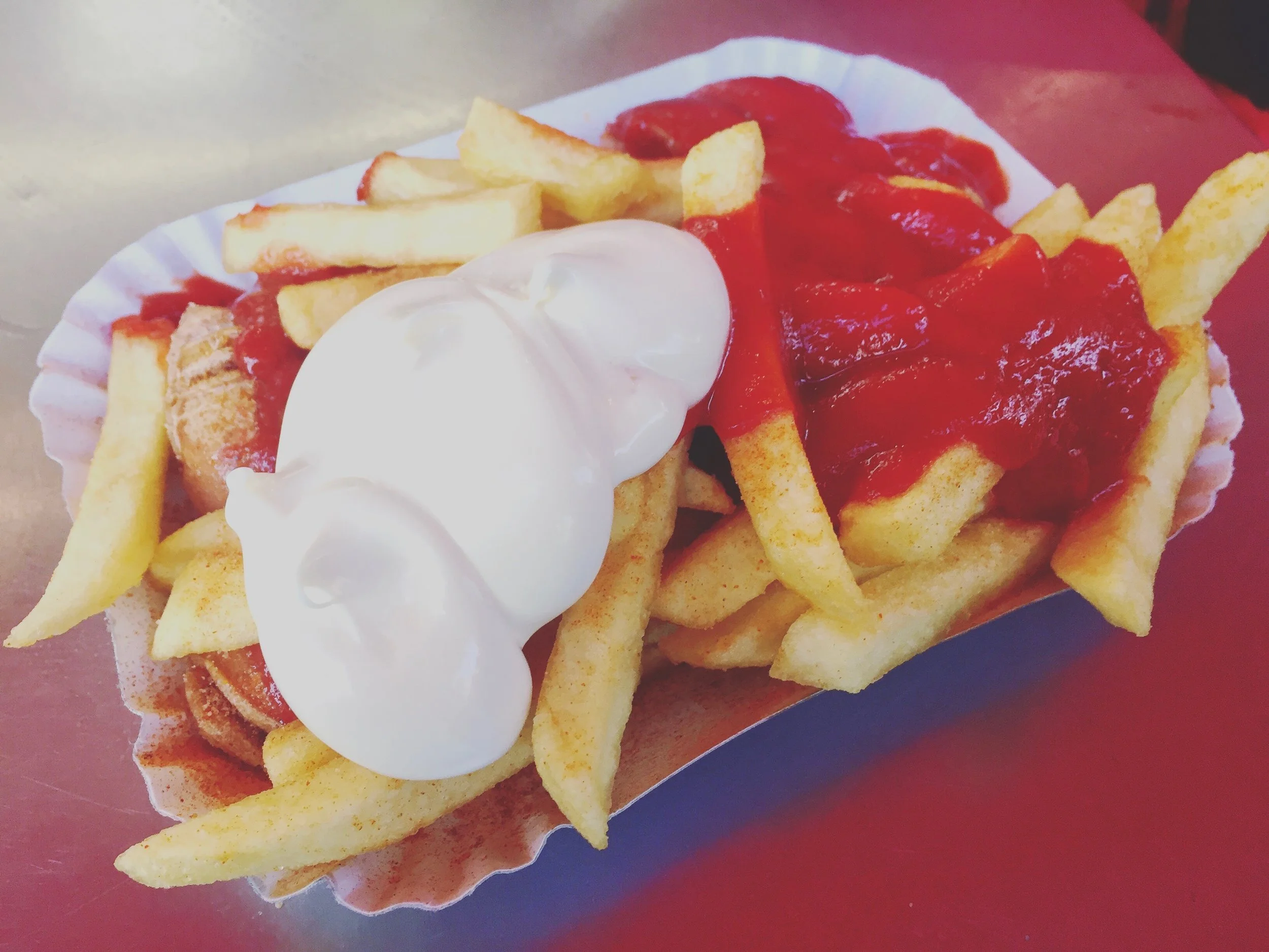 French fries, sausage, ketchup, and mayo. 