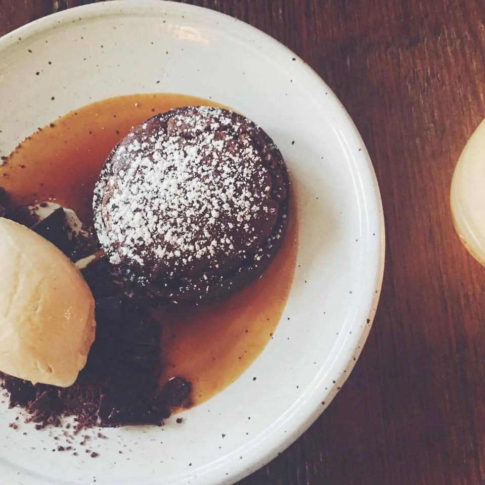 Dessert- a warm chocolate souffle tart. 