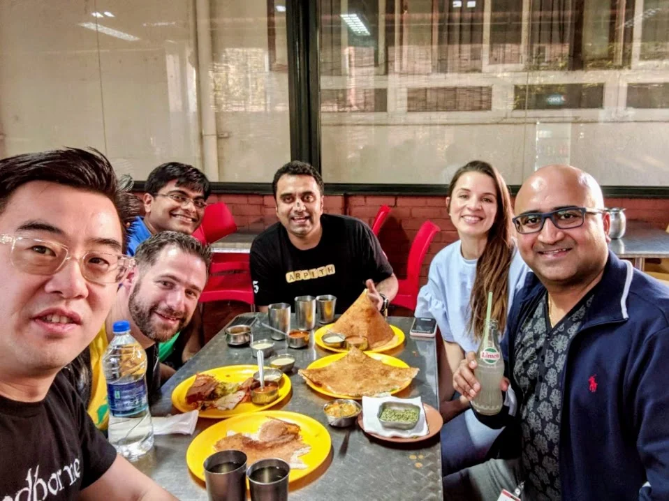 Big smiles after eating lots of dosa! 