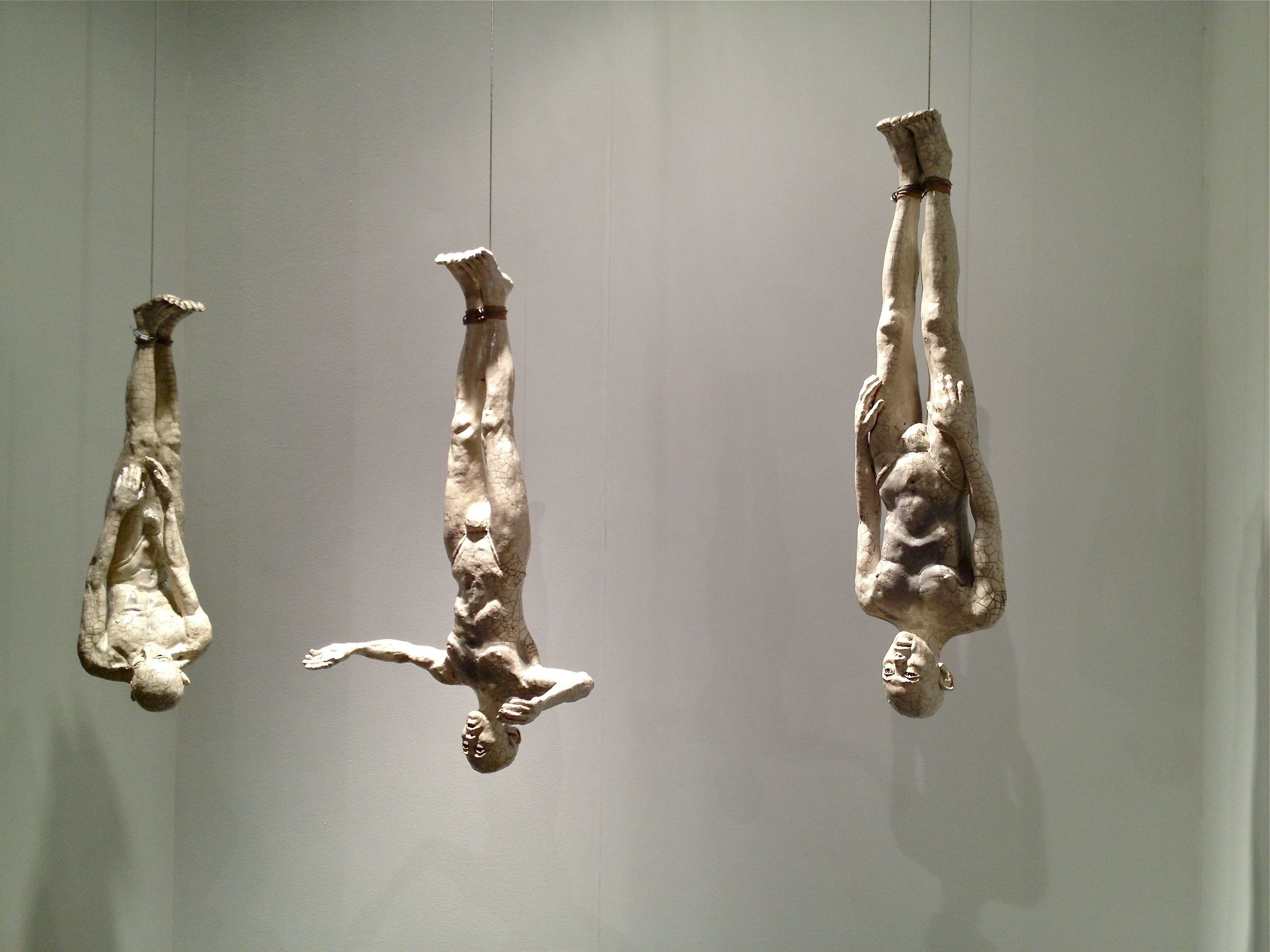   Three Hanging Butoh Figures (v3)  34"H figures, raku-fired stoneware, steel cable 