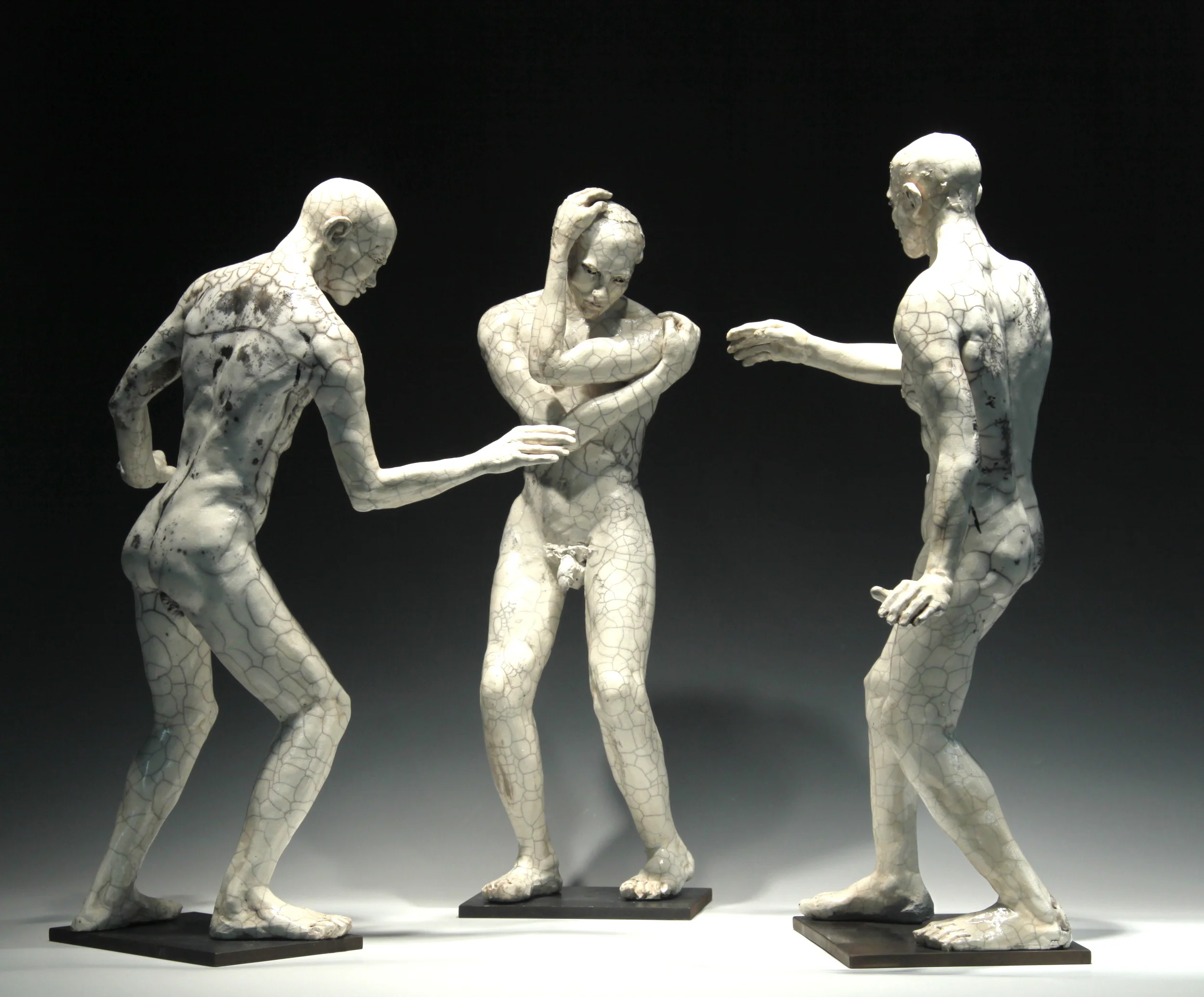 Three Male Figures (installation view) 23"H, raku-fired stoneware