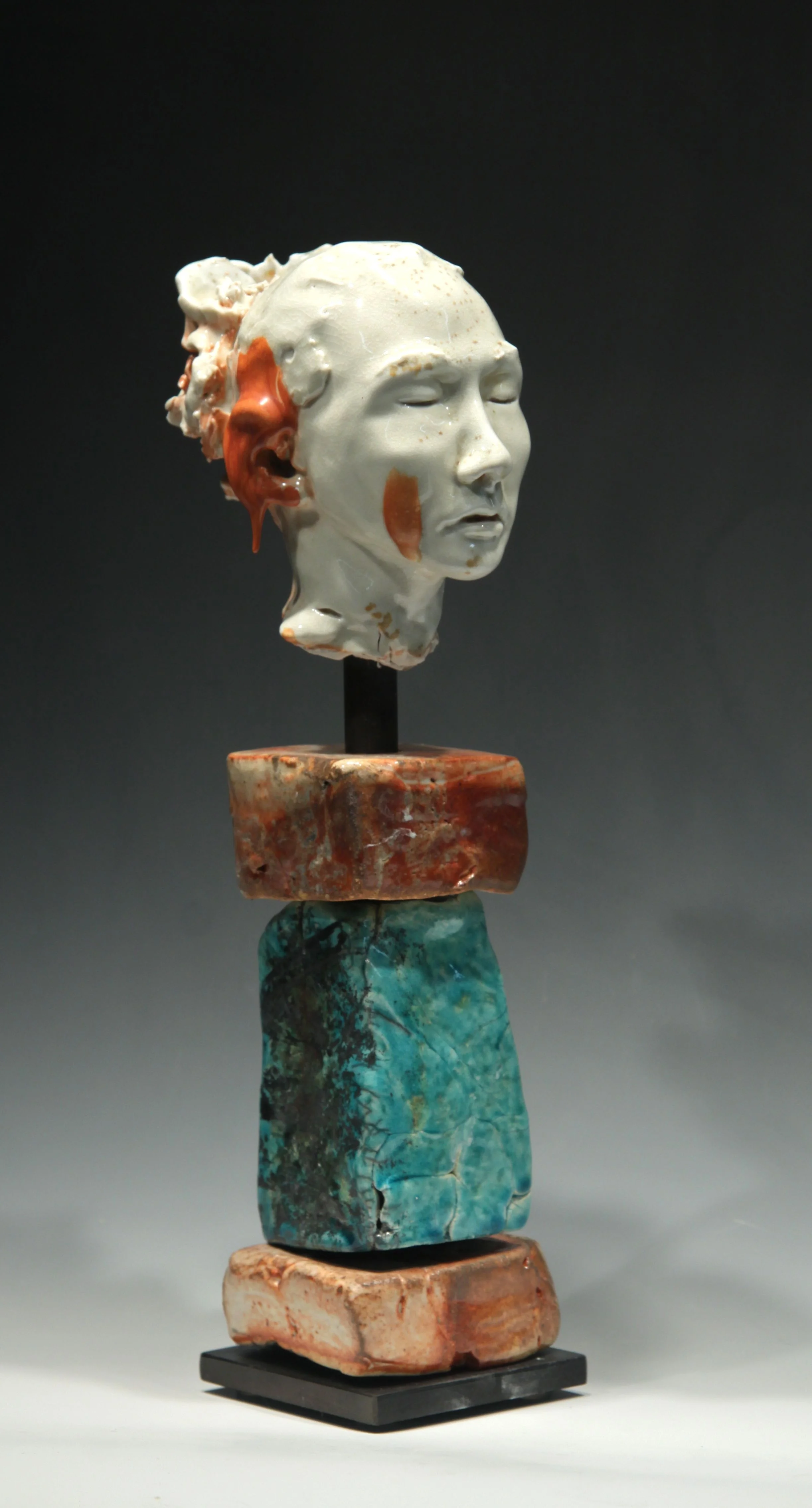 Woman's Head with Red Drip on Ear, noborigama-fired porcelain. Head Sculpture