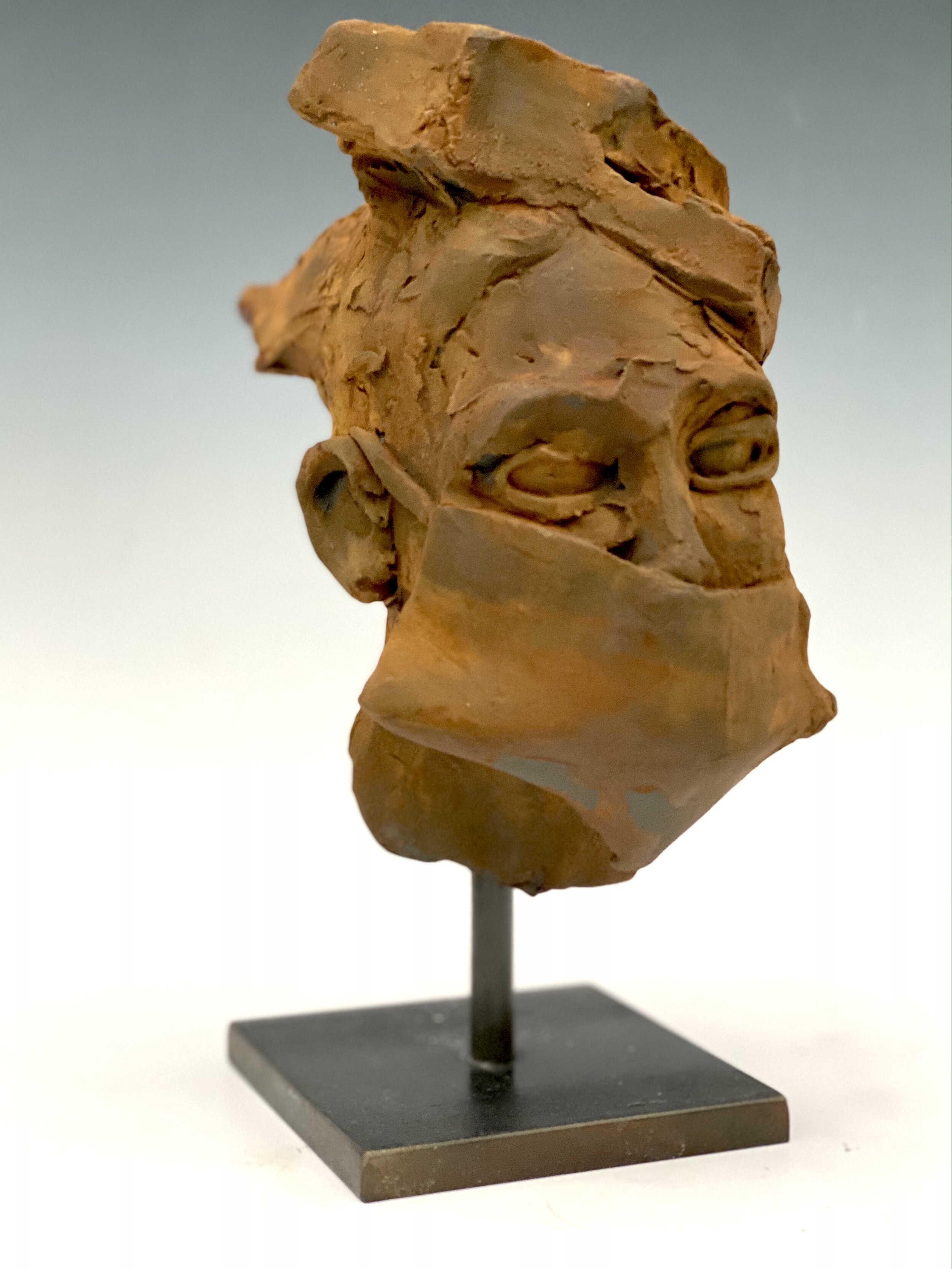  Small stoneware head with rusted iron patina- 2020 