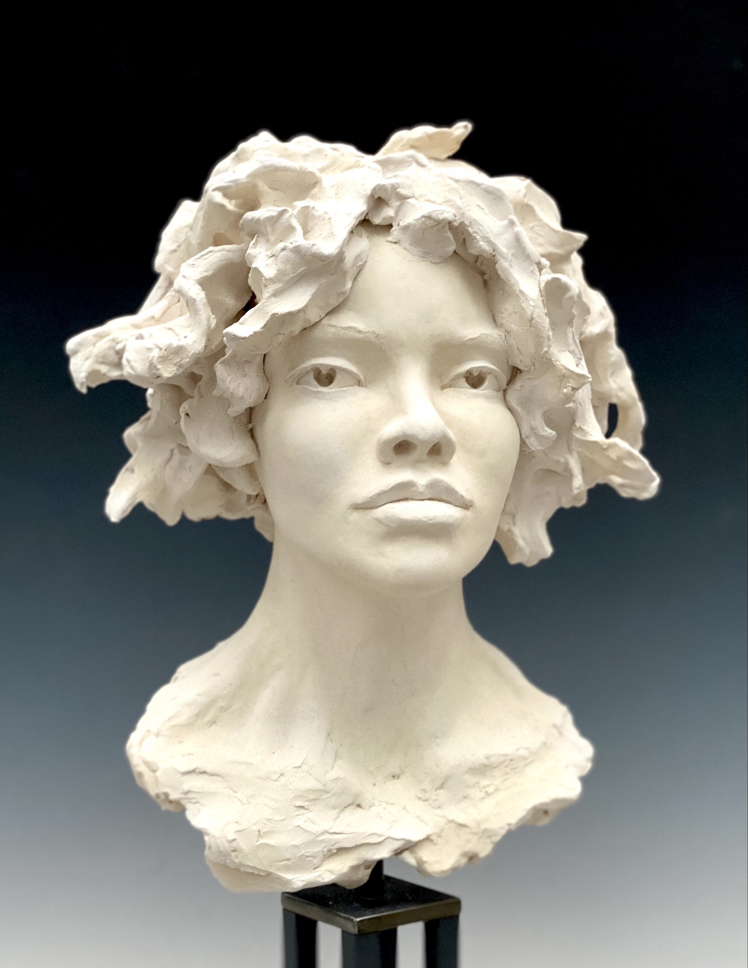  Woman’s Head, 2020, lifesize, bisque-fired stoneware on steel base. 