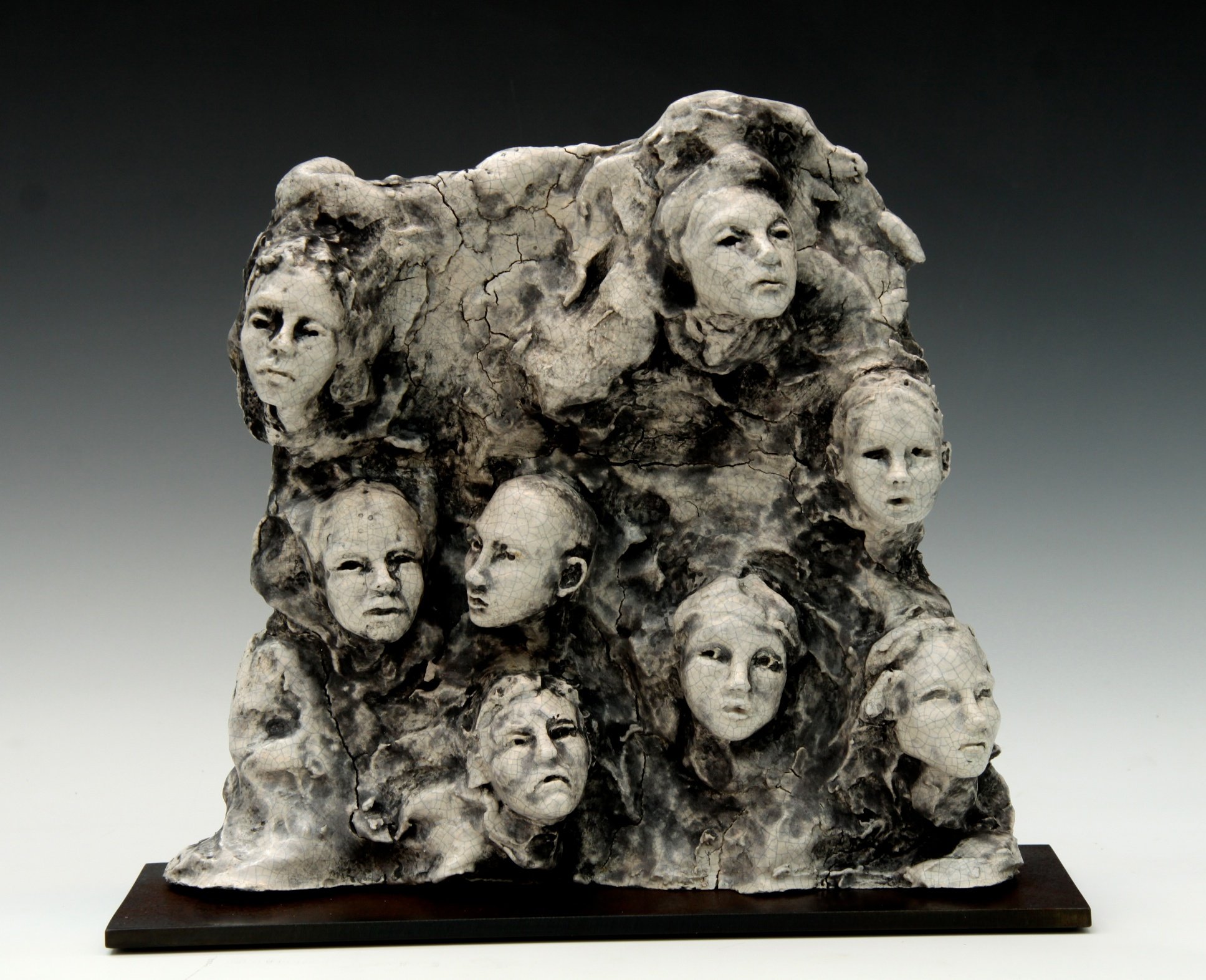 8 Heads on Slab- Steel Base- L- Bob Clyatt Sculpture.jpg