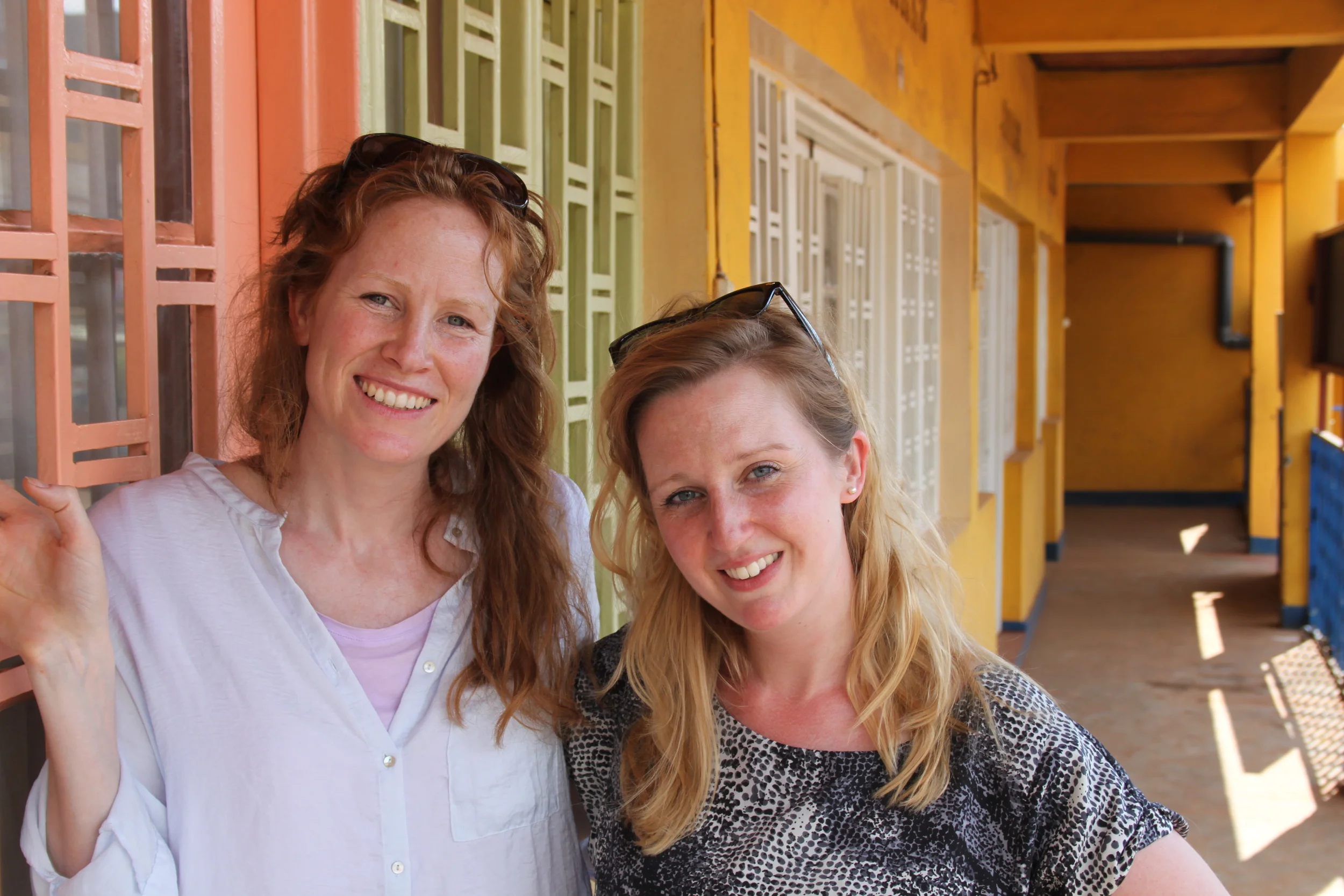 Co Founders of Project Ariadne , Georgie Weedon and Susannah Tresilian outside the Mashirika Theatre Company, Kigali Rwanda 2014