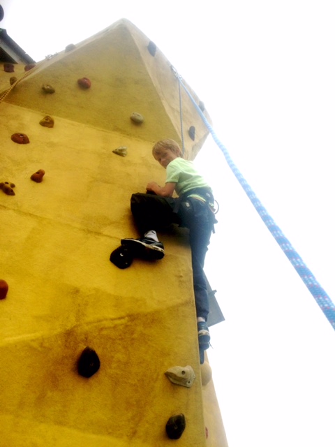  tackling the black and white route on the climbing wall&nbsp; 